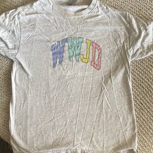 WWJD women’s tee slight discoloration at neck (see photo) has a vintage look